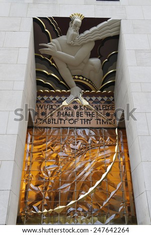NEW YORK CITY - DECEMBER 18, 2014: Wisdom, an art deco frieze by Lee Lawrie over the entrance of GE Building at Rockefeller plaza