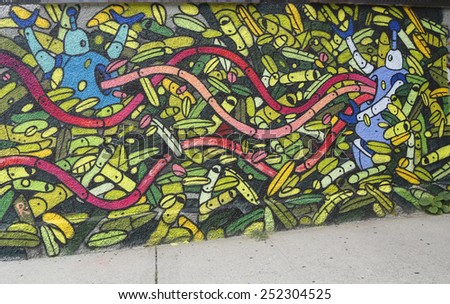 NEW YORK - JULY 24, 2014: Mural art in Astoria section of Queens. A mural is any piece of artwork painted or applied directly on a wall, ceiling or other large permanent surface