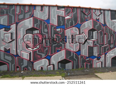 NEW YORK - JULY 24, 2014: Mural art in Astoria section in Queens. A mural is any piece of artwork painted or applied directly on a wall, ceiling or other large permanent surface