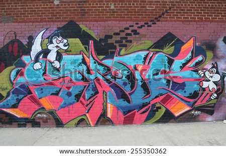 NEW YORK - JULY 24, 2014: Graffiti art at East Williamsburg in Brooklyn. Outdoor art gallery known as the Bushwick Collective has most diverse collection of street art in Brooklyn