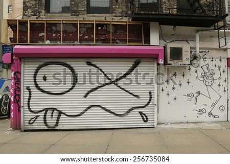 NEW YORK - FEBRUARY 26, 2015: Mural art in Little Italy in Manhattan. A mural is any piece of artwork painted or applied directly on a wall, ceiling or other large permanent surface
