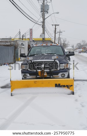 BROOKLYN, NEW YORK - MARCH 1, 2015: Snow plow truck in Brooklyn, NY ready to clean streets after massive Winter Storm Sparta strikes Northeast