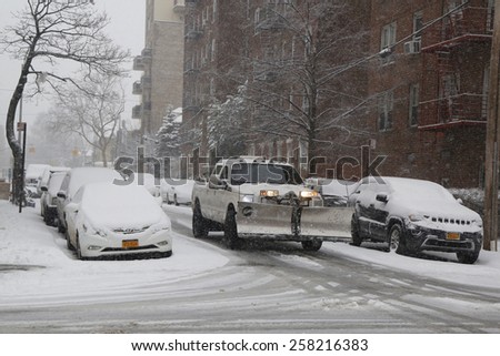 BROOKLYN, NEW YORK - MARCH 5, 2015: Snow plow truck in Brooklyn, NY during massive Winter Storm Thor