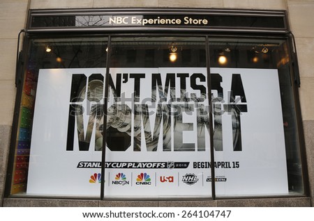 NEW YORK CITY - MARCH 26, 2015: Stanley Cup Playoffs 2014 logo displayed at the NBC Experience Store window in midtown Manhattan
