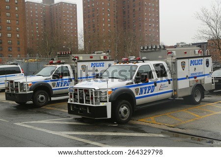 NEW YORK - MARCH 26, 2015: Police cars in East Harlem, Upper Manhattan. The New York Police Department, established in 1845, is the largest police force in USA