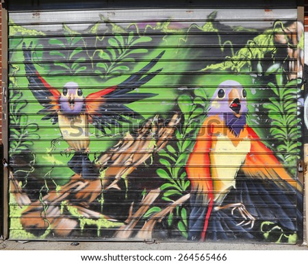 NEW YORK - MARCH 24, 2015: Mural art in Astoria section of Queens. A mural is any piece of artwork painted or applied directly on a wall, ceiling or other large permanent surface