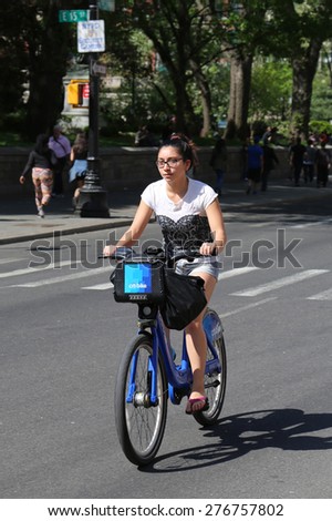 NEW YORK CITY - MAY 7, 2015: Unidentified Citi bike rider in Manhattan. NYC bike share system started in Manhattan and Brooklyn on May 27, 2013