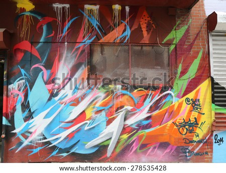 NEW YORK - MAY 12, 2015: Mural art at Dodworth Street in Brooklyn. A mural is any piece of artwork painted or applied directly on a wall, ceiling or other large permanent surface