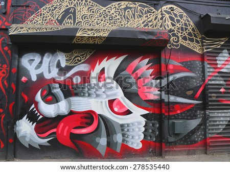 NEW YORK - MAY 12, 2015: Mural art at Dodworth Street in Brooklyn. A mural is any piece of artwork painted or applied directly on a wall, ceiling or other large permanent surface