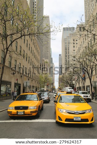 NEW YORK - APRIL 30, 2015: New York City taxis in midtown Manhattan