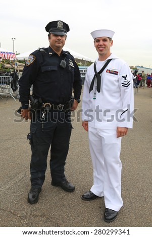 NEW YORK - MAY 20, 2015:  NYPD police officer and US sailor during Fleet Week 2015 in New York