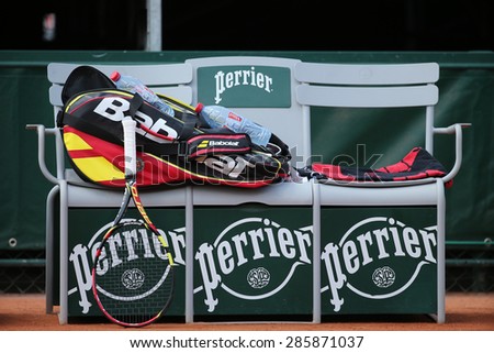 PARIS, FRANCE- MAY 30, 2015: Babolat Aero Pro racquet and Babolat bag at Le Stade Roland Garros in Paris, France. Babolat is an Official Partner of the tournament and provides racquets, balls, strings