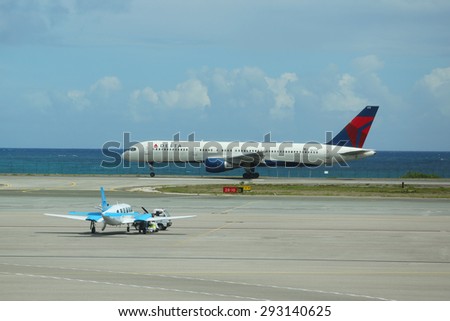 PRINCESS JULIANA AIRPORT, ST MAARTEN - JUNE 10, 2015:Delta Air Lines Boeing 757 plane landing at Princess Juliana International Airport . Airport serves the Dutch part of the island of Saint Martin.