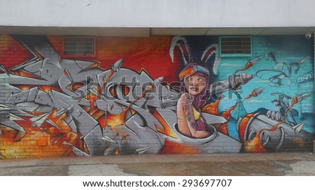 NEW YORK - JUNE 16, 2015: Mural art at Wellington Court in Astoria section in Queens. A mural is any piece of artwork painted or applied directly on a wall, ceiling or other large permanent surface