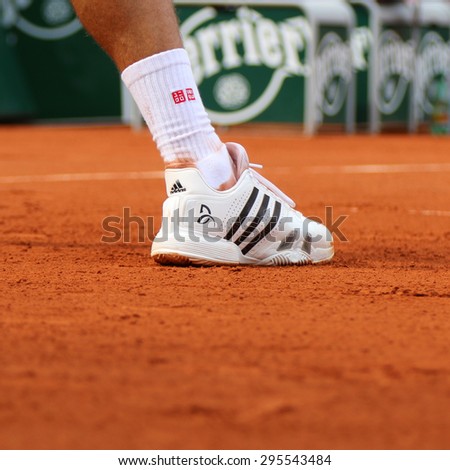 PARIS, FRANCE- MAY 28, 2015: Eight times Grand Slam champion Novak Djokovic wears custom Adidas tennis shoes during third round match at Roland Garros 2015 in Paris, France