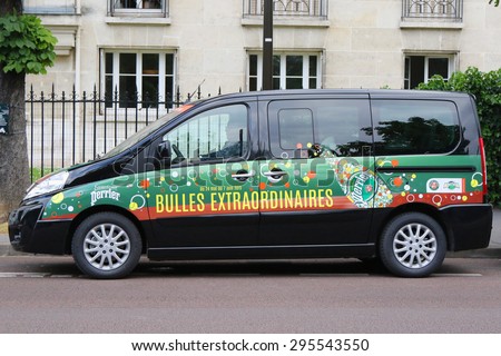 PARIS, FRANCE- MAY 26, 2015: Peugeot van with Perrier logo at Le Stade Roland Garros in Paris. Perrier and Peugeot are Official Partners of the tournament for more than 30 years.