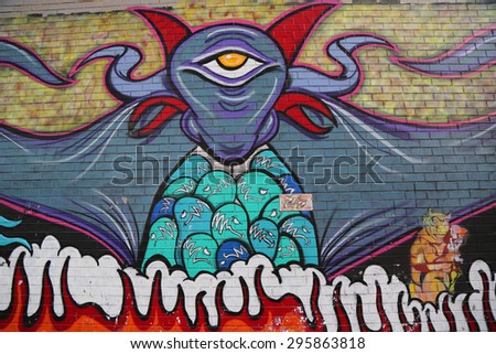 NEW YORK - JULY 5, 2015: Mural art in Hell\'s Kitchen neighborhood in Midtown Manhattan.A mural is any piece of artwork painted or applied directly on a wall, ceiling or other large permanent surface