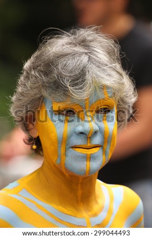 NEW YORK - JULY 18, 2015:Model during second NYC Body Painting Day in midtown Manhattan featuring artist Andy Golub in New York.Artists paint 100 fully nude models of all shapes and sizes during event