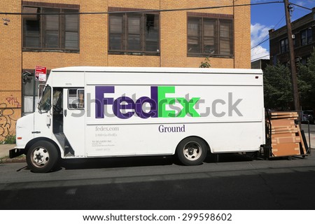 BROOKLYN, NEW YORK - JULY 23, 2015: FedEx Ground truck in Brooklyn. Fedex is one of largest package delivery companies worldwide with 300,000 employees USD 42.7 billion revenue (2012)