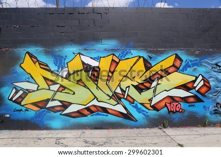 NEW YORK - JULY 23, 2015: Graffiti art at East Williamsburg in Brooklyn.Outdoor art gallery known as the Bushwick Collective has most diverse collection of street art in Brooklyn
