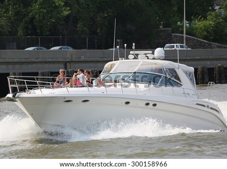 NEW YORK - JULY 5, 2015: Private boat cruised the East River in New York