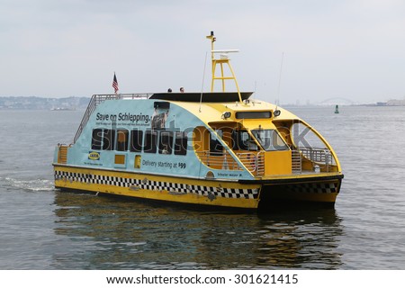 NEW YORK - JULY 30, 2015: New York City Water Taxi in the New York harbor.  NYC Water Taxi has been servicing NYC commuters since 2002