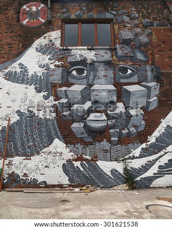 NEW YORK - JUNE 30, 2015: Mural art in Red Hook section of Brooklyn. A mural is any piece of artwork painted or applied directly on a wall, ceiling or other large permanent surface