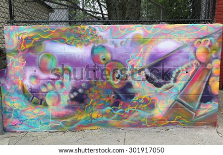 NEW YORK - MAY 21, 2015: Mural art at Centre-fuge Project in Staten Island, NY. A mural is any piece of artwork painted or applied directly on a wall, ceiling or other large permanent surface
