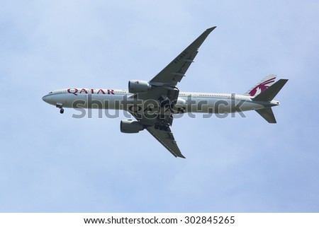 NEW YORK - AUGUST 2, 2015: Qatar  Airways Boeing 777 descending for landing at JFK International Airport in New York. Qatar Airways is the state-owned flag carrier of Qatar