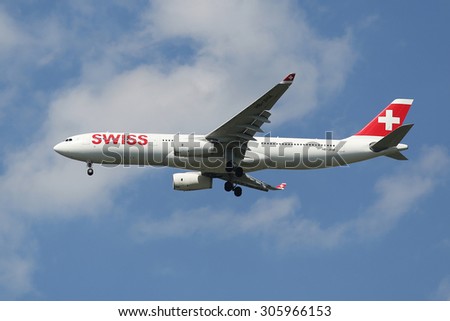 NEW YORK - AUGUST 13, 2015: Swiss Air A330 descending for landing at JFK International Airport in New York