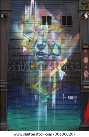 NEW YORK - JULY 17, 2015: Mural art in Lower Manhattan. A mural is any piece of artwork painted or applied directly on a wall, ceiling or other large permanent surface