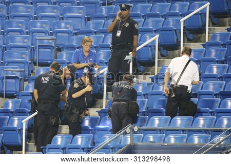 NEW YORK - SEPTEMBER 3, 2015: New York Police Department investigates incident involving drone during  match at US Open 2015 at Billie Jean King National Tennis Center in New York