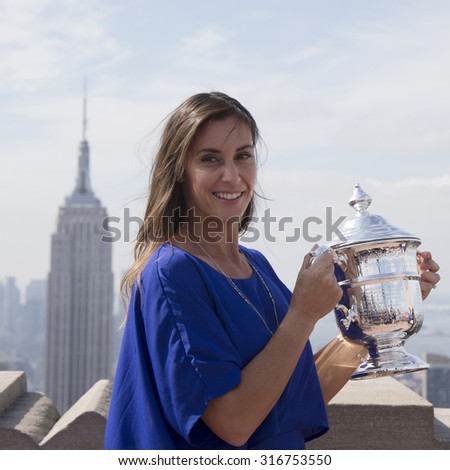 NEW YORK CITY - SEPTEMBER 13, 2015: US Open 2015 champion Flavia Pennetta posing with US Open trophy on the Top of the Rock Observation Deck at Rockefeller Center in New York
