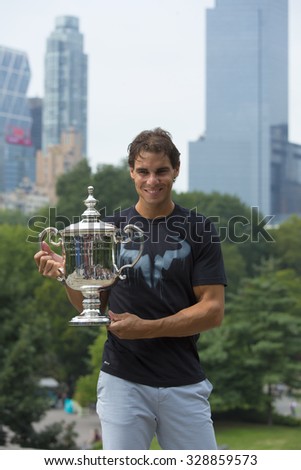 NEW YORK CITY - SEPTEMBER 10, 2013: US Open 2013 champion Rafael Nadal posing with US Open trophy in Central Park