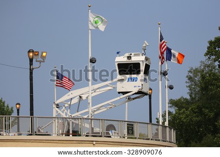 NEW YORK - SEPTEMBER 1, 2015: NYPD Sky Watch platform placed near National Tennis Center in Flushing. SkyWatch platform provides flexible surveillance options for high level security