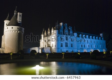 Night illumination of a fountain in the garden of the famous castle Chenonceau. Loire Valley, France.