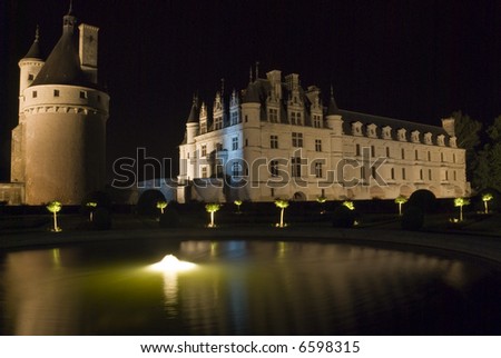 Night illumination of a fountain in the garden of the famous castle Chenonceau. Loire Valley, France.