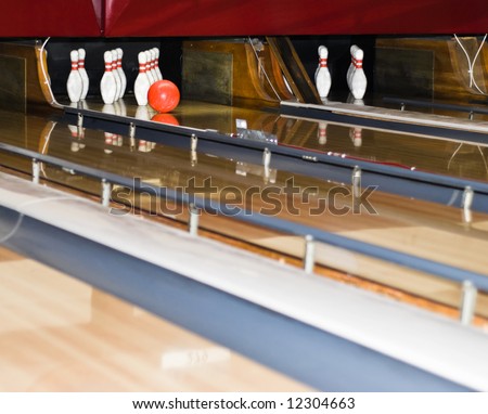 Bowling Game. A ball approaching the pins.
