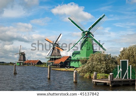 Traditional Dutch landscape with a range of windmills.