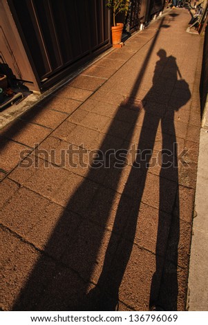 human shadow on the street