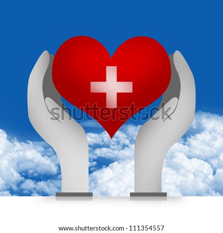 Heart and Cross Sign Over The Hand in Blue Sky Background For Heart Donation Concept