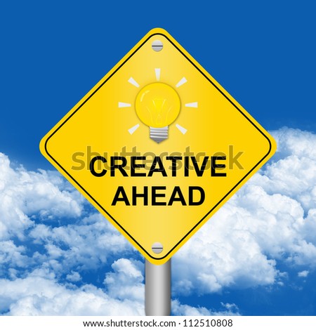 Yellow Creative Ahead With Light Bulb Road Sign For Idea Concept in Blue Sky Background