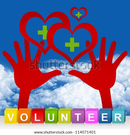 Colorful Volunteer Cube Box And Two Hands Holding Red Heart With Green Cross Inside For Heart Donation Concept in Blue Sky Background