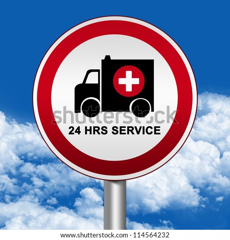 Circle Silver Metallic and Red Metallic Border Road Sign For Ambulance Car 24 HRS Service Against The Blue Sky Background