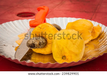 Fresh cashew fruits on a plate. Goa, India