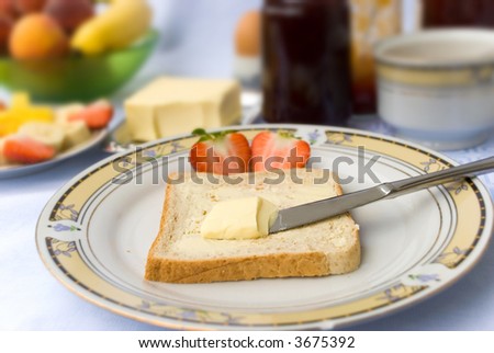 Breakfast with Butter,Jam,Juice and colorful Fruits