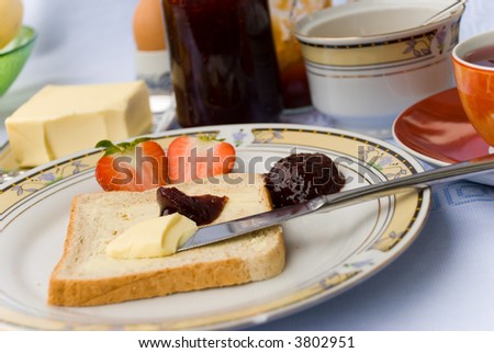 Breakfast with jam,eggs,fruits and coffee