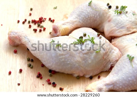 fresh chicken leg with cress
