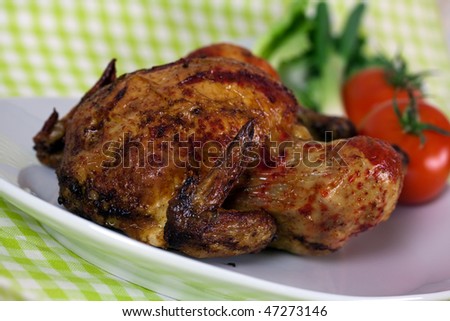 Delicious roasted chicken - delicate art of Portuguese,with crust of ketchup
