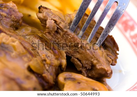 sirloin strip steak with french fries and rice,cream sauce